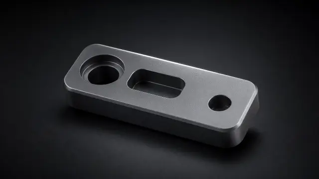 Fondo de pantalla 4K IA: Pieza metálica industrial gris oscuro con agujeros