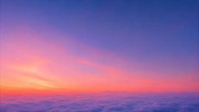 Atardecer sobre nubes con tonos rosados y morados