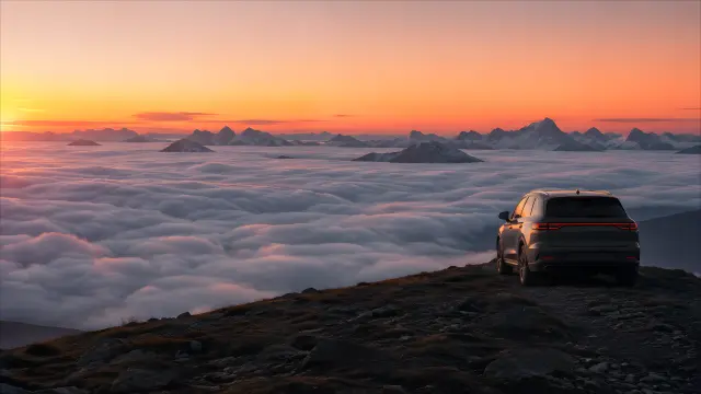Fondo de pantalla SUV sobre montañas al atardecer