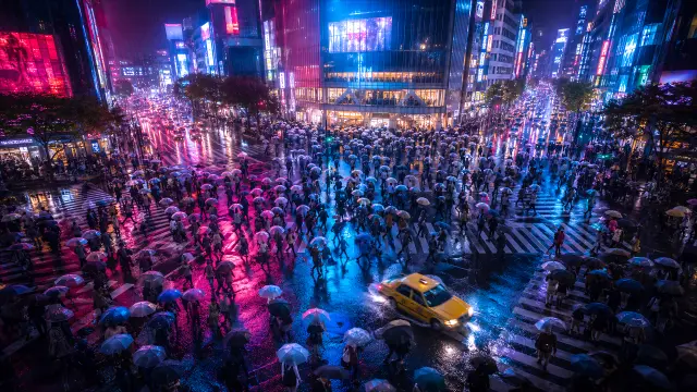 Multitud de paraguas bajo la lluvia en ciudad neón nocturna
