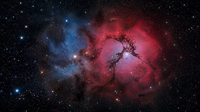 Nebulosa roja y azul con estrellas en el espacio profundo